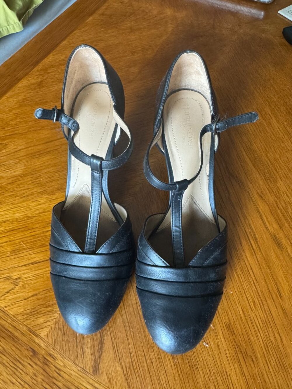 Professional black closed-toe heels with straps